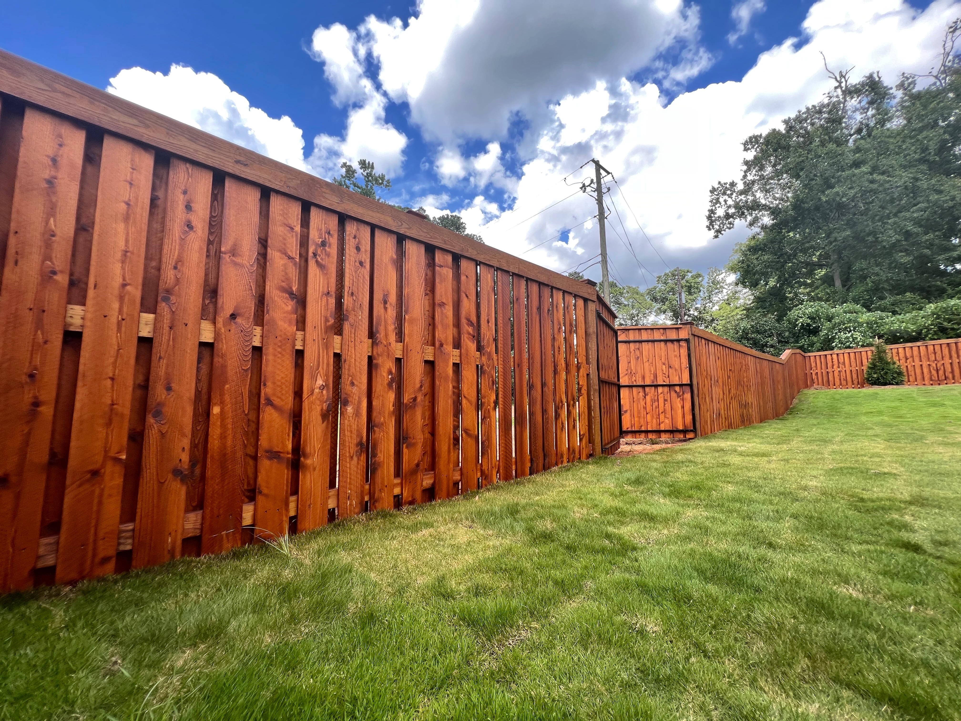 Beautifully stained fence by AFR Stain & Seal in Auburn, Alabama